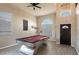Spacious game room with high ceilings, a modern pool table, and large windows for natural light at 1282 W Kesler Ln, Chandler, AZ 85224