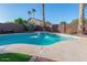 Inviting backyard pool with desert landscaping and a cozy bench at 1282 W Kesler Ln, Chandler, AZ 85224