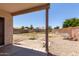 Spacious backyard with gravel landscaping, patio, and block wall, perfect for outdoor living at 12825 W Virginia Ave, Avondale, AZ 85392