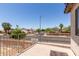 Balcony overlooking a neighborhood with palm trees and single-Gathering homes at 12825 W Virginia Ave, Avondale, AZ 85392