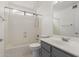 Well-lit bathroom featuring a vanity, mirror, toilet, and a shower-tub combination at 12825 W Virginia Ave, Avondale, AZ 85392