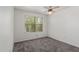 Bedroom with carpet, a ceiling fan, and natural light at 12825 W Virginia Ave, Avondale, AZ 85392
