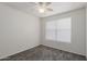 A cozy bedroom with plush carpet and a window, ready for relaxation at 12825 W Virginia Ave, Avondale, AZ 85392