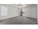 Bedroom with carpet, a ceiling fan, and sliding glass doors at 12825 W Virginia Ave, Avondale, AZ 85392