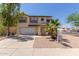 Beautiful two-story home with a well-maintained lawn, neutral colors, and a two car garage at 12825 W Virginia Ave, Avondale, AZ 85392