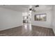 Bright living room with laminate floors and an open view to the kitchen at 12825 W Virginia Ave, Avondale, AZ 85392