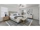 Bright main bedroom with a king bed, area rug, and sliding doors to an outdoor patio at 12825 W Virginia Ave, Avondale, AZ 85392