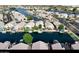 Aerial view of a waterfront community with boats and palm trees at 14623 N 90Th Ln, Peoria, AZ 85381