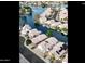 Aerial view of a waterfront community with boats docked at homes at 14623 N 90Th Ln, Peoria, AZ 85381