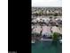 Aerial view of a waterfront community with boats and palm trees at 14623 N 90Th Ln, Peoria, AZ 85381