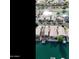 Aerial view of a waterfront community with boats and palm trees at 14623 N 90Th Ln, Peoria, AZ 85381