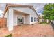 Backyard view with a patio, sliding glass doors, and windows at 14623 N 90Th Ln, Peoria, AZ 85381