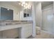 Bright bathroom with granite vanity, walk-in shower, and neutral decor at 14623 N 90Th Ln, Peoria, AZ 85381