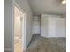 Bedroom with en-suite bathroom and comfortable, neutral carpeting at 14623 N 90Th Ln, Peoria, AZ 85381