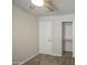 Cozy bedroom features carpet, a ceiling fan, and a closet with storage for a comfortable living space at 14623 N 90Th Ln, Peoria, AZ 85381