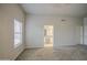 Large bedroom boasts neutral carpet, natural light and ensuite bathroom access at 14623 N 90Th Ln, Peoria, AZ 85381