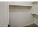 Walk-in closet with shelves and rod for ample clothing storage at 14623 N 90Th Ln, Peoria, AZ 85381