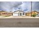 Lovely one-story home with a two-car garage and beautiful front yard landscaping at 14623 N 90Th Ln, Peoria, AZ 85381