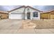 Lovely home with a two-car garage, beautiful desert landscaping and flagstone walkway at 14623 N 90Th Ln, Peoria, AZ 85381