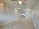 Spacious living room featuring sleek wood flooring and contemporary lighting at 14623 N 90Th Ln, Peoria, AZ 85381