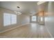 Bright living room with modern lighting and hardwood floors showcases a welcoming and stylish space at 14623 N 90Th Ln, Peoria, AZ 85381