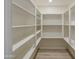 Well-organized pantry with ample shelving for storage and easy access at 14623 N 90Th Ln, Peoria, AZ 85381