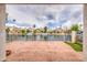 View from a covered patio to waterfront homes with boats, divided by a black iron fence at 14623 N 90Th Ln, Peoria, AZ 85381