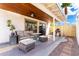 Outdoor back patio with comfortable wicker furniture set, a grill, and privacy fence at 16496 N 68Th Ave, Peoria, AZ 85382