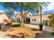 A spacious backyard with a tree providing shade and a combination of gravel and concrete areas at 16496 N 68Th Ave, Peoria, AZ 85382