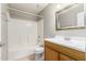 Bathroom featuring a shower-tub combination and a wood vanity with a large mirror at 16496 N 68Th Ave, Peoria, AZ 85382