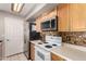 Well-equipped kitchen featuring stainless steel appliances, ample counter space, and efficient layout at 16496 N 68Th Ave, Peoria, AZ 85382