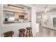 Eat-in kitchen with bar seating and access to the outside with stainless steel appliances at 16496 N 68Th Ave, Peoria, AZ 85382