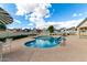 Community pool with white lounge chairs and tables at 16496 N 68Th Ave, Peoria, AZ 85382