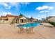 Community pool with lounge chairs and a blue umbrella at 16496 N 68Th Ave, Peoria, AZ 85382