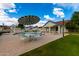 Inviting community pool with seating areas and a clear blue sky at 16496 N 68Th Ave, Peoria, AZ 85382