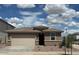 Charming single-Gathering home with a two-car garage and desert landscaping at 17016 W Cavedale Dr, Surprise, AZ 85387