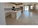 Bright kitchen with white cabinets, stainless steel appliances, and a large center island at 17016 W Cavedale Dr, Surprise, AZ 85387