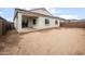 Spacious backyard with covered patio, block wall, and room to create your dream oasis at 17767 W Getty Dr, Goodyear, AZ 85338