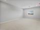 Bright bedroom with neutral carpet and good light from a window at 17767 W Getty Dr, Goodyear, AZ 85338