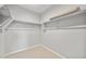 Walk in closet with carpeted floor and shelves at 17767 W Getty Dr, Goodyear, AZ 85338