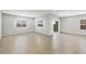 Spacious living room with tile flooring, ample natural light, and sliding door to the patio at 17767 W Getty Dr, Goodyear, AZ 85338