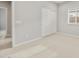 Spacious bedroom with neutral carpet, a closet with sliding doors, and a window, offering a comfortable retreat at 17770 W Getty Dr, Goodyear, AZ 85338