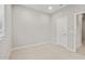 Comfortable bedroom with neutral carpet, a double-door closet, and a bright window, offering a blank canvas at 17770 W Getty Dr, Goodyear, AZ 85338