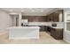Bright kitchen with stainless steel appliances, a large island, and modern lighting at 17770 W Getty Dr, Goodyear, AZ 85338