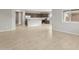 Open concept living area flowing into the kitchen, perfect for entertaining at 17770 W Getty Dr, Goodyear, AZ 85338