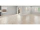 Spacious living area with tile flooring and natural light from multiple windows at 17770 W Getty Dr, Goodyear, AZ 85338