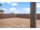 View of the backyard featuring block wall and desert landscaping at 17779 W Getty Dr, Goodyear, AZ 85338