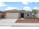 Charming single-story home featuring a two-car garage and low-maintenance landscaping at 17779 W Getty Dr, Goodyear, AZ 85338