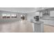 Open floor plan featuring a kitchen island and ample living space with natural light at 17779 W Getty Dr, Goodyear, AZ 85338