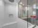 This spacious shower boasts multiple showerheads and tiled walls and seating at 17791 W Getty Dr, Goodyear, AZ 85338